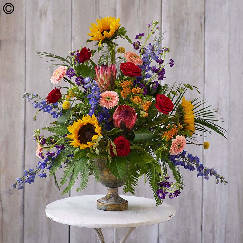 Service arrangement tribute made with the finest flowers